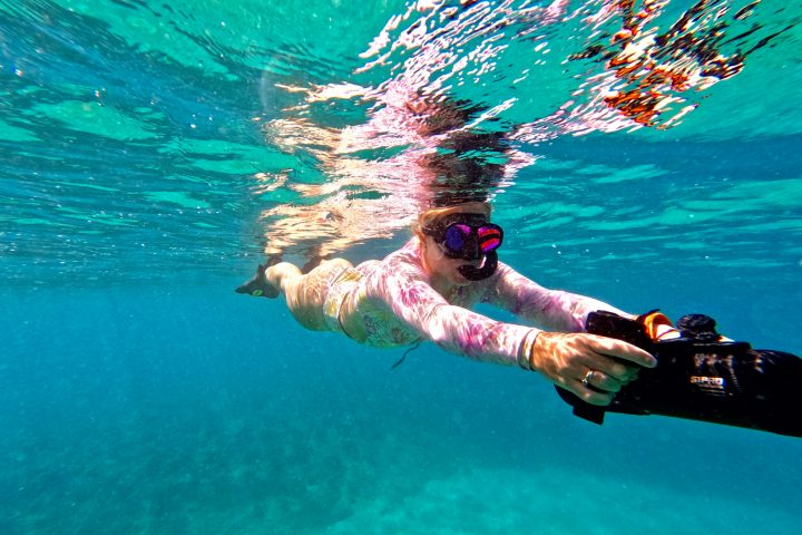 a person swimming in a body of water